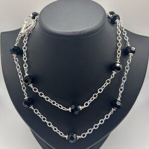 Heidi Daus silver tone black crystal long necklace